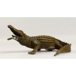 A BRONZE MODEL OF A CROCODILE. 9.5ins long.