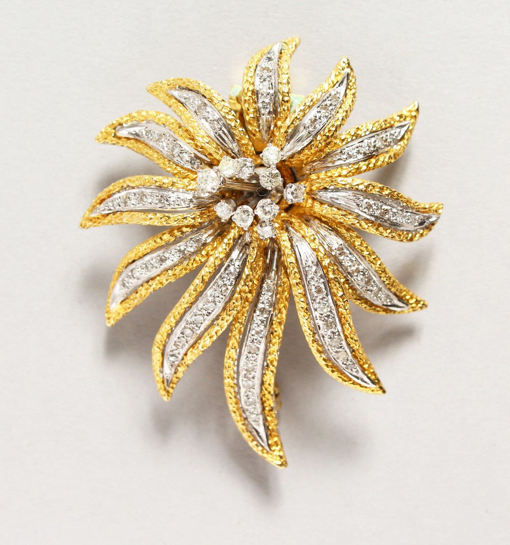 A GOOD 18CT GOLD AND DIAMOND SET FLOWER HEAD BROOCH. 2.25ins long.