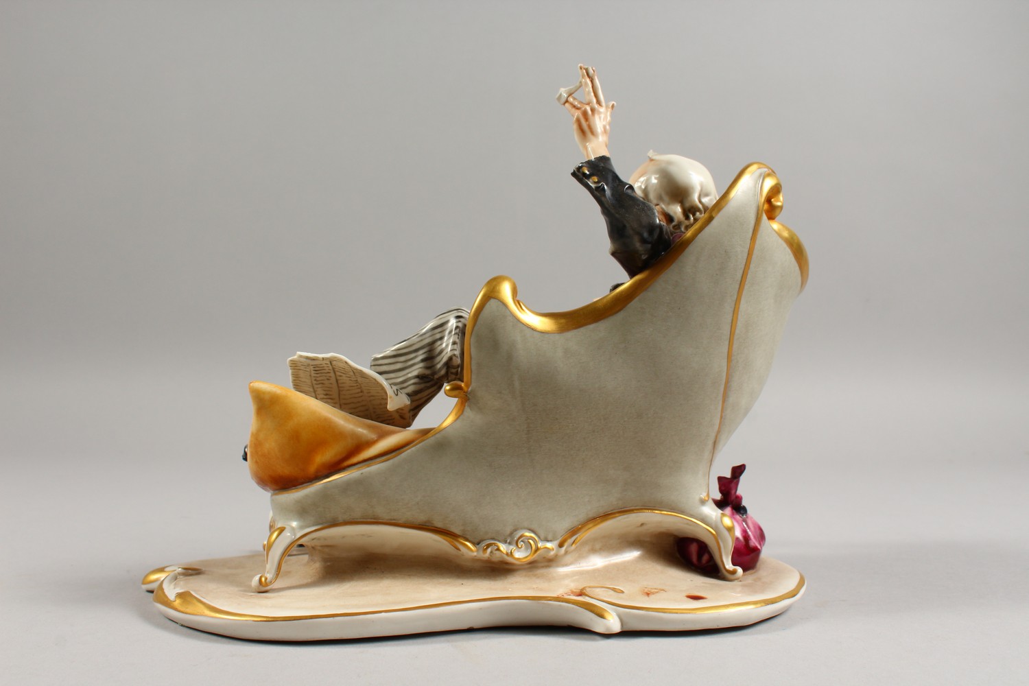 A CAPODIMONTE GROUP, a man on a chaise longue, a dog by his side. 9.5ins wide. - Image 6 of 10