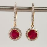 A PAIR OF 14K YELLOW GOLD AND DIAMOND EARRINGS, fitted with a pair of round cut rubies approx. 3.