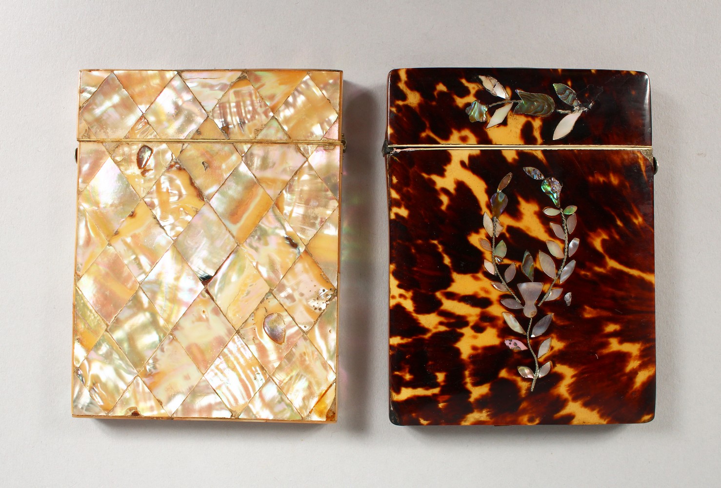 A 19TH CENTURY MOTHER-OF-PEARL CALLING CARD CASE, and a similar tortoiseshell case. 4ins x 3ins.