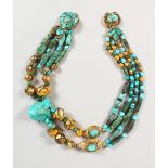 A LARGE ROMAN TURQUOISE BEAD NECKLACE, mounted in a contemporary gilt metal setting.