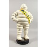 A CAST IRON MODEL OF THE MICHELIN MAN. 15ins high.
