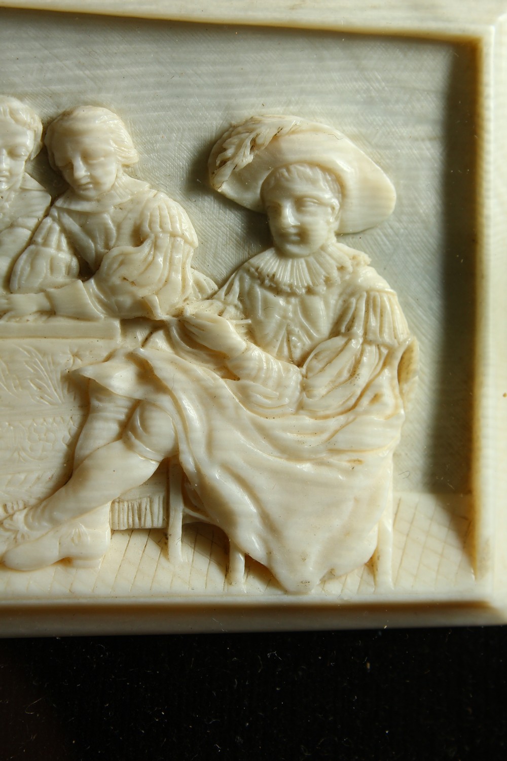 A GOOD SMALL CARVED IVORY PLAQUE, LATE 19TH/EARLY 20TH CENTURY, depicting cavaliers seated around - Image 6 of 7