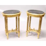 A PAIR OF FRENCH STYLE OVAL GILTWOOD OCCASIONAL TABLES, with marble tops. 1ft ins wide x 2ft 4ins