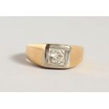 A 14CT GOLD AND DIAMOND RING.