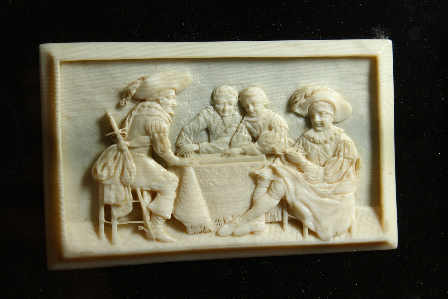 A GOOD SMALL CARVED IVORY PLAQUE, LATE 19TH/EARLY 20TH CENTURY, depicting cavaliers seated around - Image 3 of 7