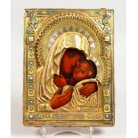 A RUSSIAN SILVER GILT ICON. Madonna and Child Silver Marks A.B. over 1888, other marks faint. 8ins x