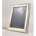 A LARGE UPRIGHT PHOTOGRAPH FRAME. 9ins x 7ins.
