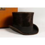 AN OLD TOP HAT, in a fitted case.