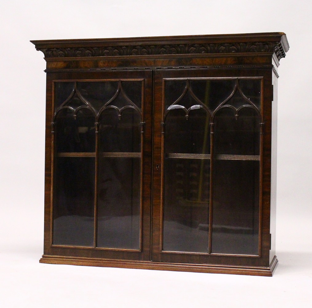 A GOOD MID 20TH CENTURY MAHOGANY WALL CABINET, by WARING & GILLOW, with carved cornice, pair of