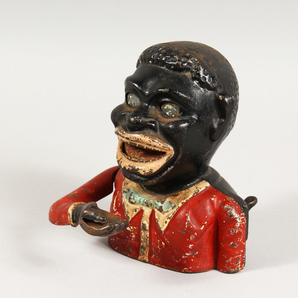 AN EARLY 20TH CENTURY NOVELTY CAST IRON MONEY BANK.