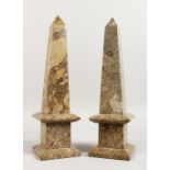 A PAIR OF 20TH CENTURY GREY MARBLE OBELISKS. 14.5ins high.
