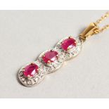 A 9CT GOLD, RUBY AND DIAMOND PENDANT on a chain.