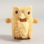 A BONE OWL TAPE MEASURE.