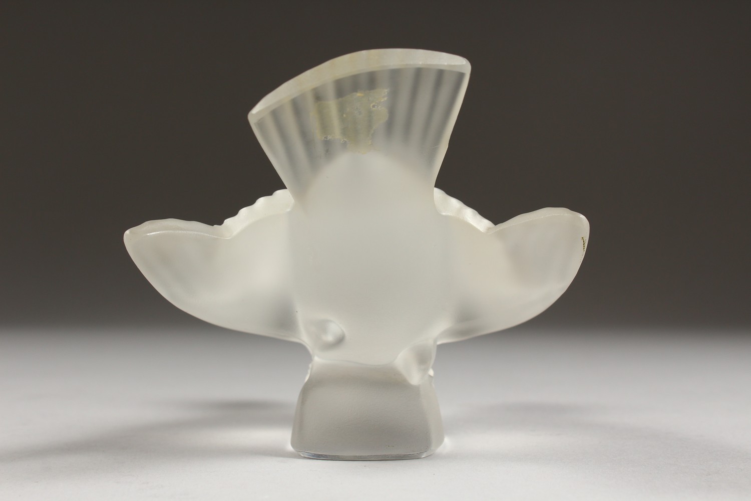 A LALIQUE FROSTED GLASS MODEL OF A BIRD, wings outswept, (base chipped). 5ins long. - Image 3 of 7