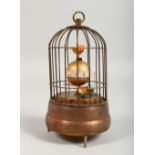 A BIRD CAGE AUTOMATON CLOCK. 6.5ins high.