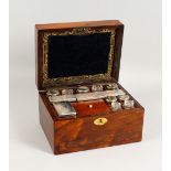 A VICTORIAN ROSEWOOD DRESSING TABLE BOX, the fitted interior with cut glass jars and boxes with