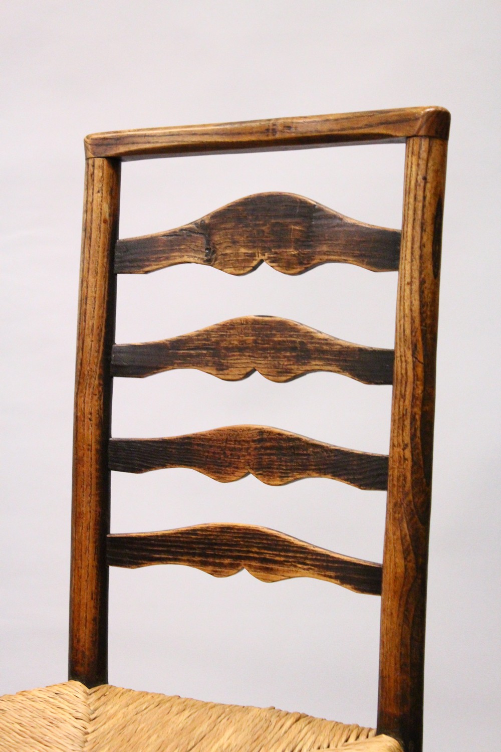 A MATCHED SET OF SIX 19TH CENTURY ASH AND ELM LADDER BACK DINING CHAIRS, two with arms, with rush - Image 3 of 8