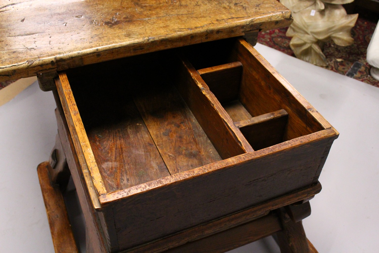 AN UNUSUAL EARLY 18TH CENTURY CONTINENTAL FRUITWOOD AND PINE RENT TABLE, with a sliding thick - Image 5 of 7