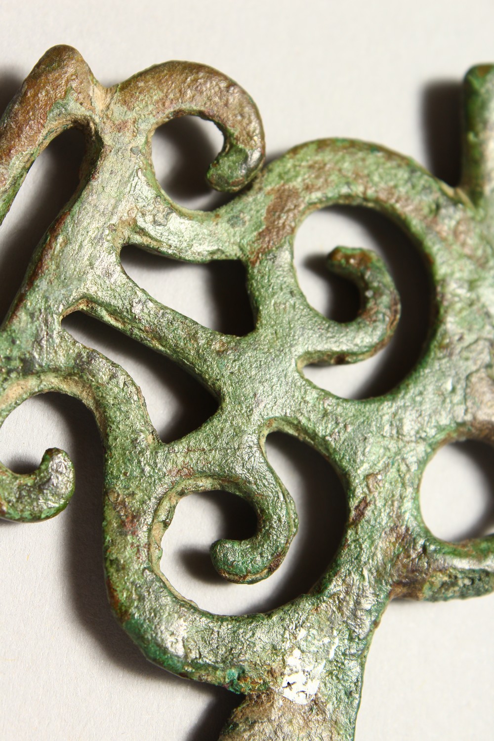 A ROMAN PIERCED BRONZE AMULET/BUCKLE. 3ins wide. - Image 4 of 4