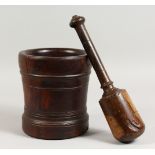 AN 18TH/19TH CENTURY LIGNUM VITAE PESTLE AND MORTAR. Mortar: 8ins high.