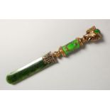 A SILVER, JADE, ENAMEL AND DIAMOND LETTER OPENER, the handle mounted with an elephant, in a wooden