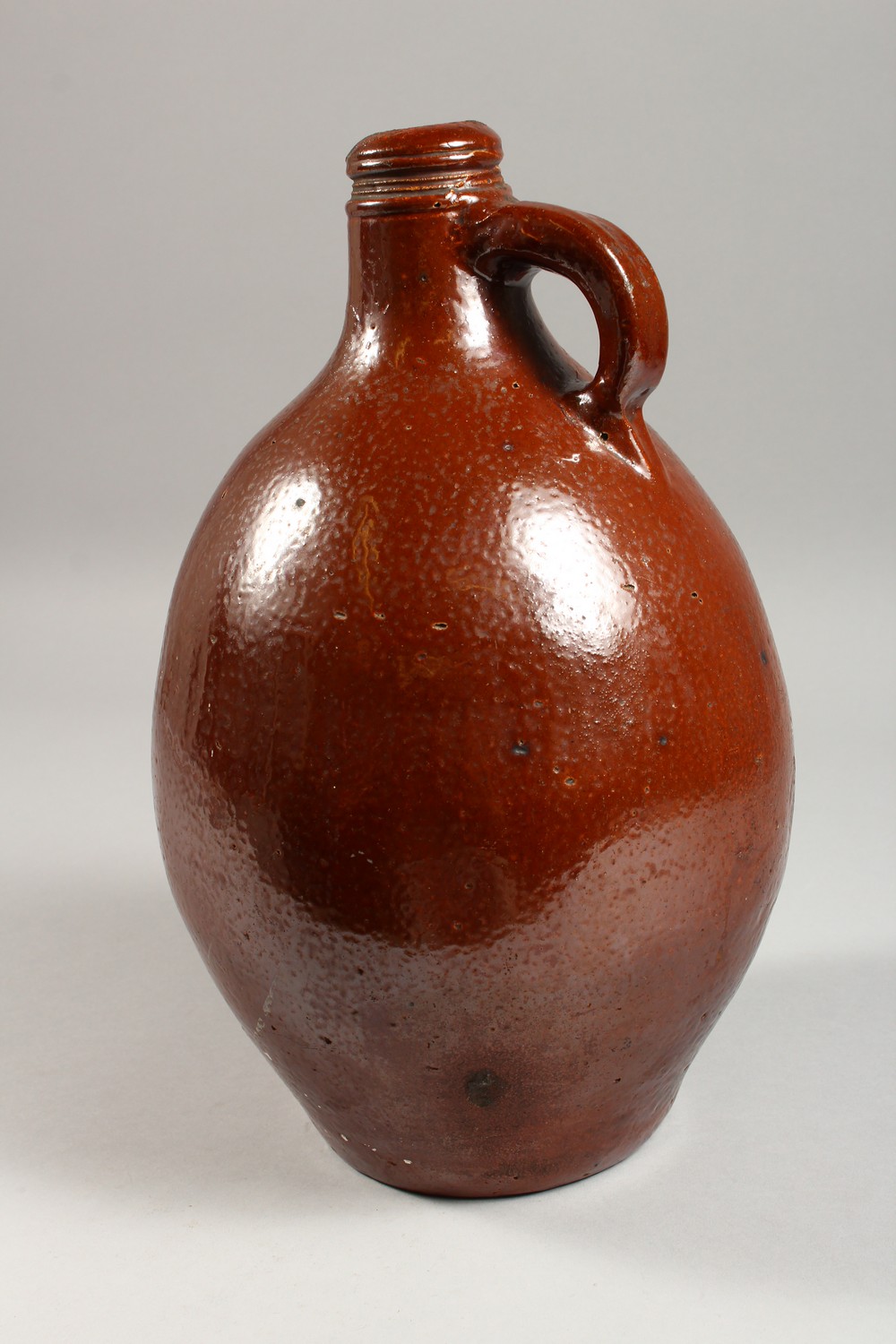 A LARGE BELLARMINE STYLE STONEWARE JUG. 13.5ins high. - Image 3 of 6