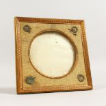 AN EMPIRE STYLE SQUARE SHAPE PHOTOGRAPH FRAME, with gilt metal mounts. 6.5ins high x 6.5ins wide.