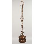 AN 18TH CENTURY JEWISH HANGING BRONZE OIL LAMP with chain. Lamp: 5.5ins high.