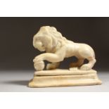 A CARVED ALABASTER MODEL OF A LION, on a plinth base. 6.25ins long.