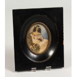 AN OVAL PORTRAIT MINIATURE, young lady wearing a white dress with a shawl, signed, in an ebony