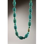 A LARGE TURQUOISE NECKLACE.