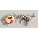 TWO NOVELTY SILVER HORSE RELATED BROOCHES.