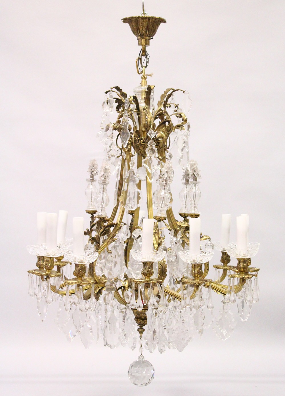 A VERY GOOD LOUIS XVI DESIGN ORMOLU AND CUT GLASS TWELVE BRANCH CHANDELIER, the upper tier with