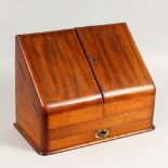 A VICTORIAN MAHOGANY STATIONERY BOX, hinged opening covers, fitted interior and drawer below.