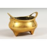 A POLISHED BRONZE TWIN-HANDLED CENSER. 5.25ins wide.