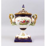 A ROYAL WORCESTER URN, COVER AND STAND, blue and white ground, painted with birds and flowers.