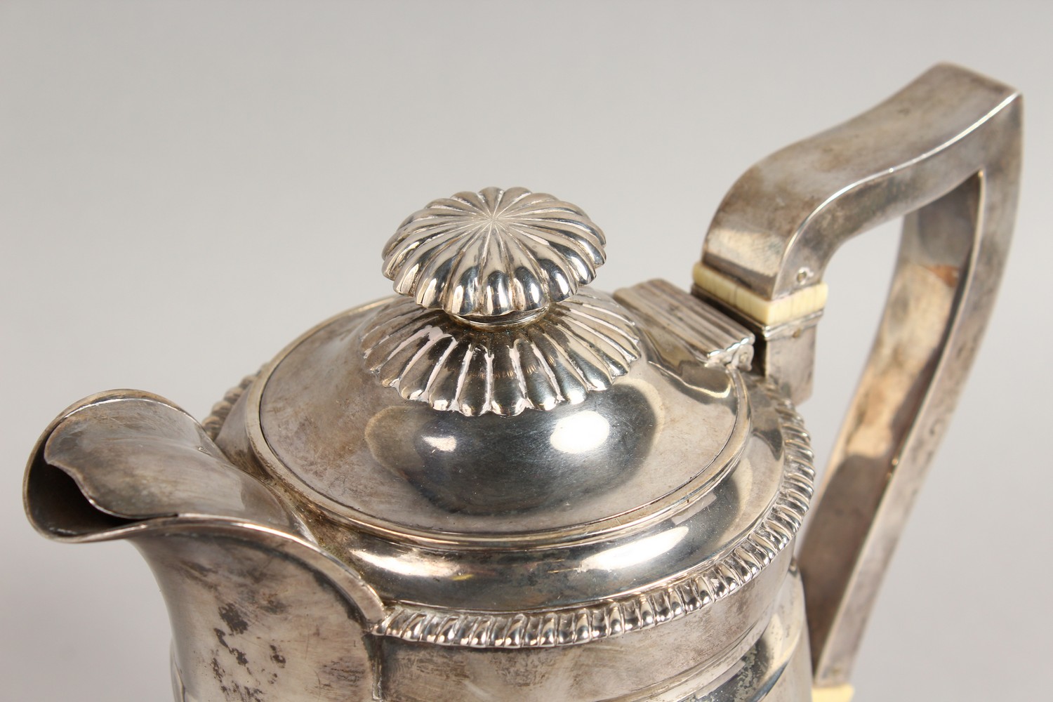 A GEORGE III SEMI FLUTED JUG, with gadrooned edge, crested. London 1815. Maker: R.E. Weight 22ozs. - Image 2 of 11