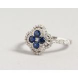 AN 18CT WHITE GOLD, SAPPHIRE AND DIAMOND RING, in the form of a four leaf clover.