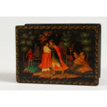 A RUSSIAN LACQUER BOX, decorated with a young couple in a woodland setting. 3.5ins x 2.5ins.