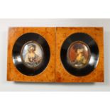 A PAIR OF OVAL PORTRAIT MINIATURES, young lady wearing 18th century style dresses and hats, in