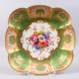 A GOOD ROYAL WORCESTER SQUARE DISH, with green and gilt border, the centre painted with flowers by