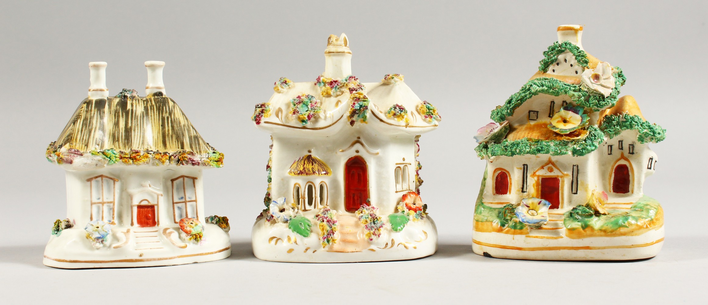 THREE SMALL 19TH CENTURY STAFFORDSHIRE PASTILLE BURNER COTTAGES.