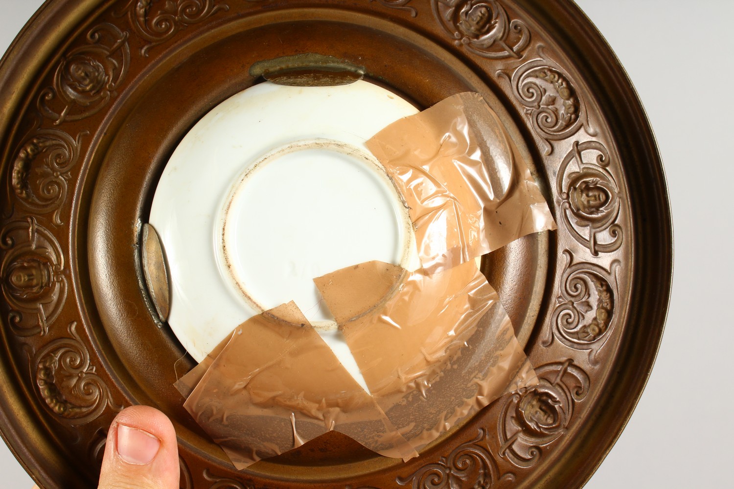 A PAIR OF EMBOSSED CIRCULAR BRASS PLAQUES, inset with porcelain panel decorated with portrait busts. - Image 6 of 6