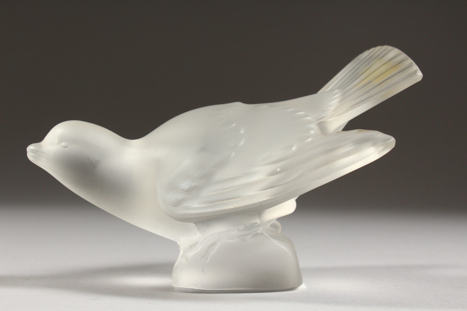 A LALIQUE FROSTED GLASS MODEL OF A BIRD, wings outswept, (base chipped). 5ins long. - Image 4 of 7