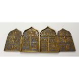 A FOUR PIECE RUSSIAN BRASS AND BLUE ENAMEL FOLDING ICON, with sixteen small panels, 1.75ins square
