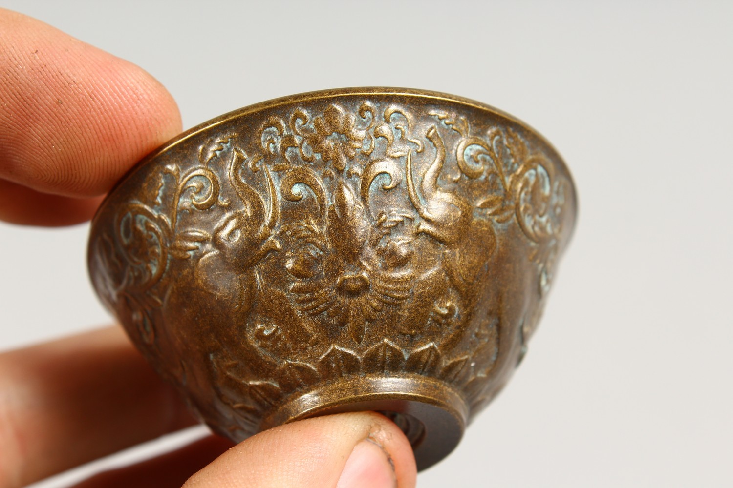 A SMALL BRONZE CUP. 2.5ins diameter. - Image 2 of 5