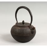 A JAPANESE CAST IRON TEAPOT. 7ins wide.