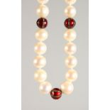 A PEARL NECKLACE, with three diamond and enamel sections and 18ct gold clasp. 18ins long.